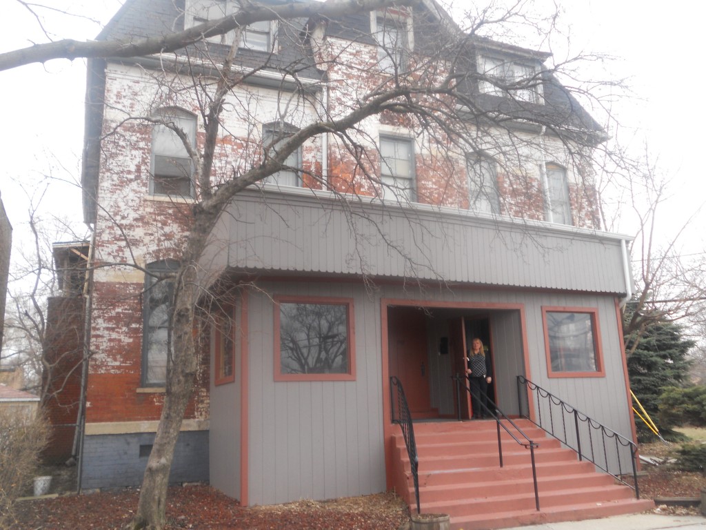 Sharon Biggerstaff in front of the old Landmark Inn, March 28, 2014