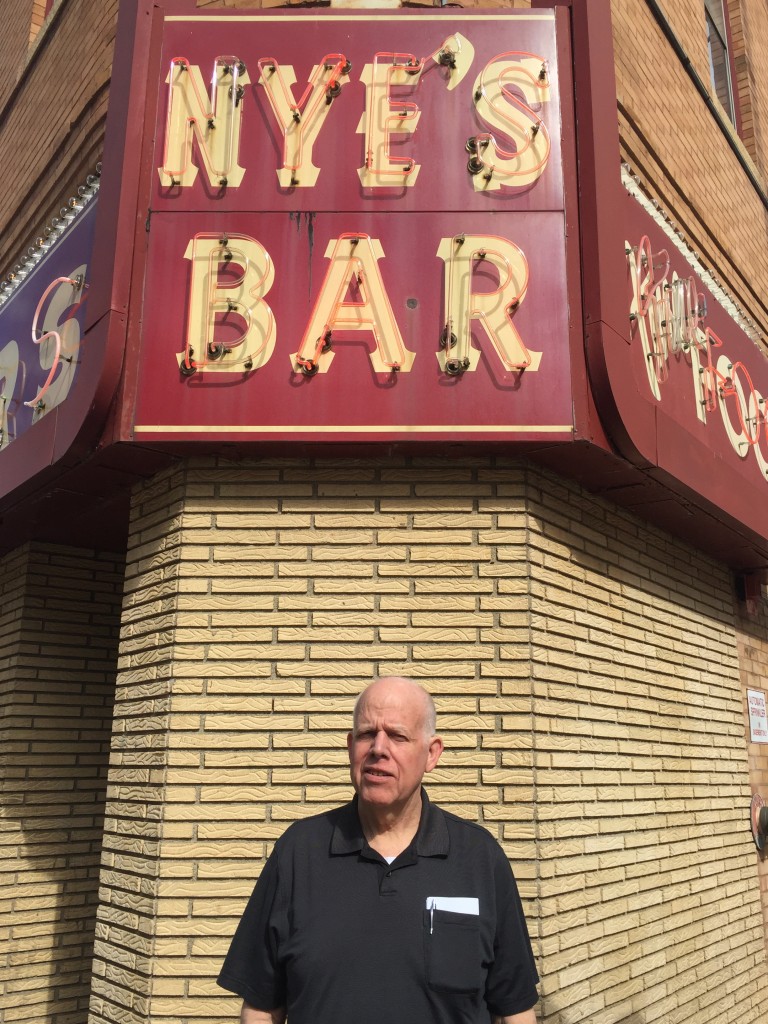 Phil Barker in daylight in front of the original bar.